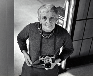 Photographer Dorothea Lange with her camera